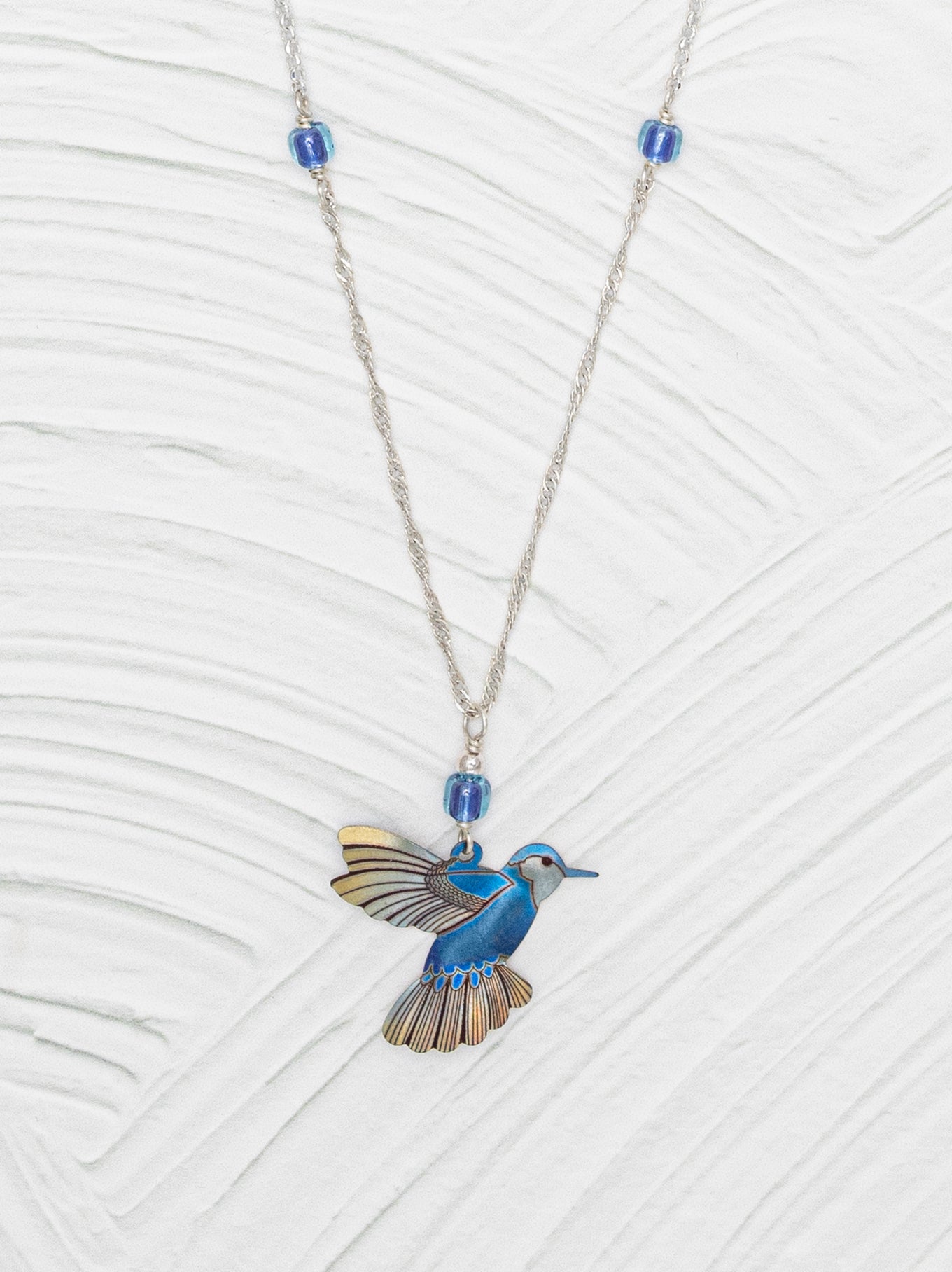 Picaflor Pendant Necklace with niobium hummingbird. – Holly Yashi