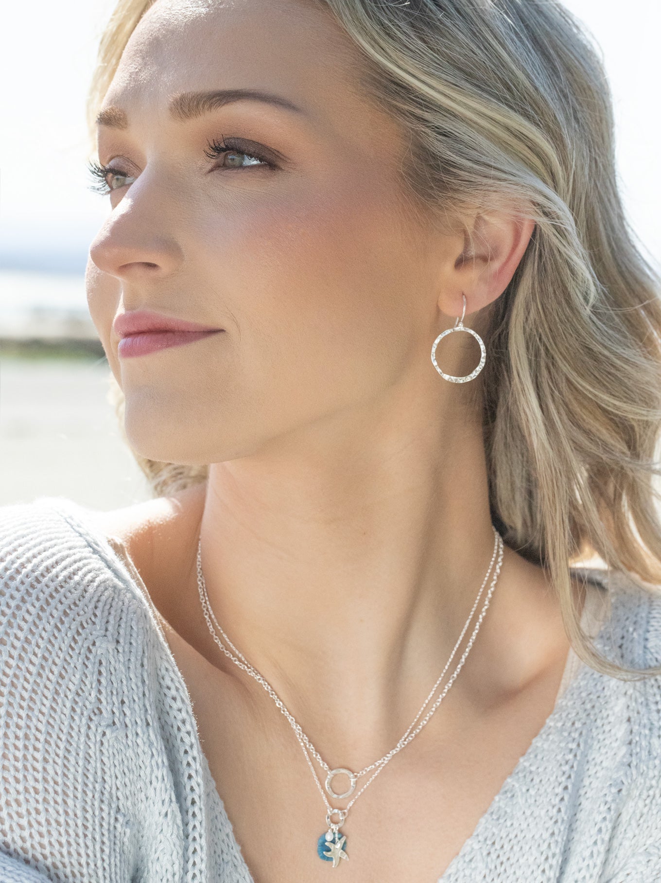 hand-hammered circle charm links to a delicate chain hand-hammered circle charm links to a delicate chain